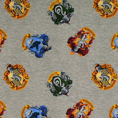 Reststück: 1,00m Baumwolljersey Lizenz -Star Wars Wappen der 4 Hogwarts Häuser - hellgrau