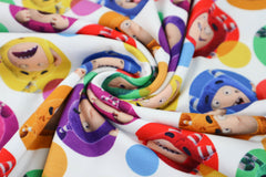 Reststück: 0,90m Lizenz Baumwolljersey Digital Toystory - bunte Kringel -