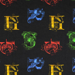 Reststück: 1,00m Baumwolljersey Lizenz -Star Wars Wappen von Hogwarts schwarz bunt
