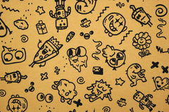 Reststück: 1,00m - Sweatshirt Stoff crazy Cartoons ocker