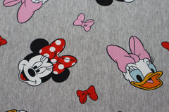 Reststück : 1,00m -  French Terry Lizenz  Minnie Mouse & Daisy hellgrau meliert mit Schleifen im Haar