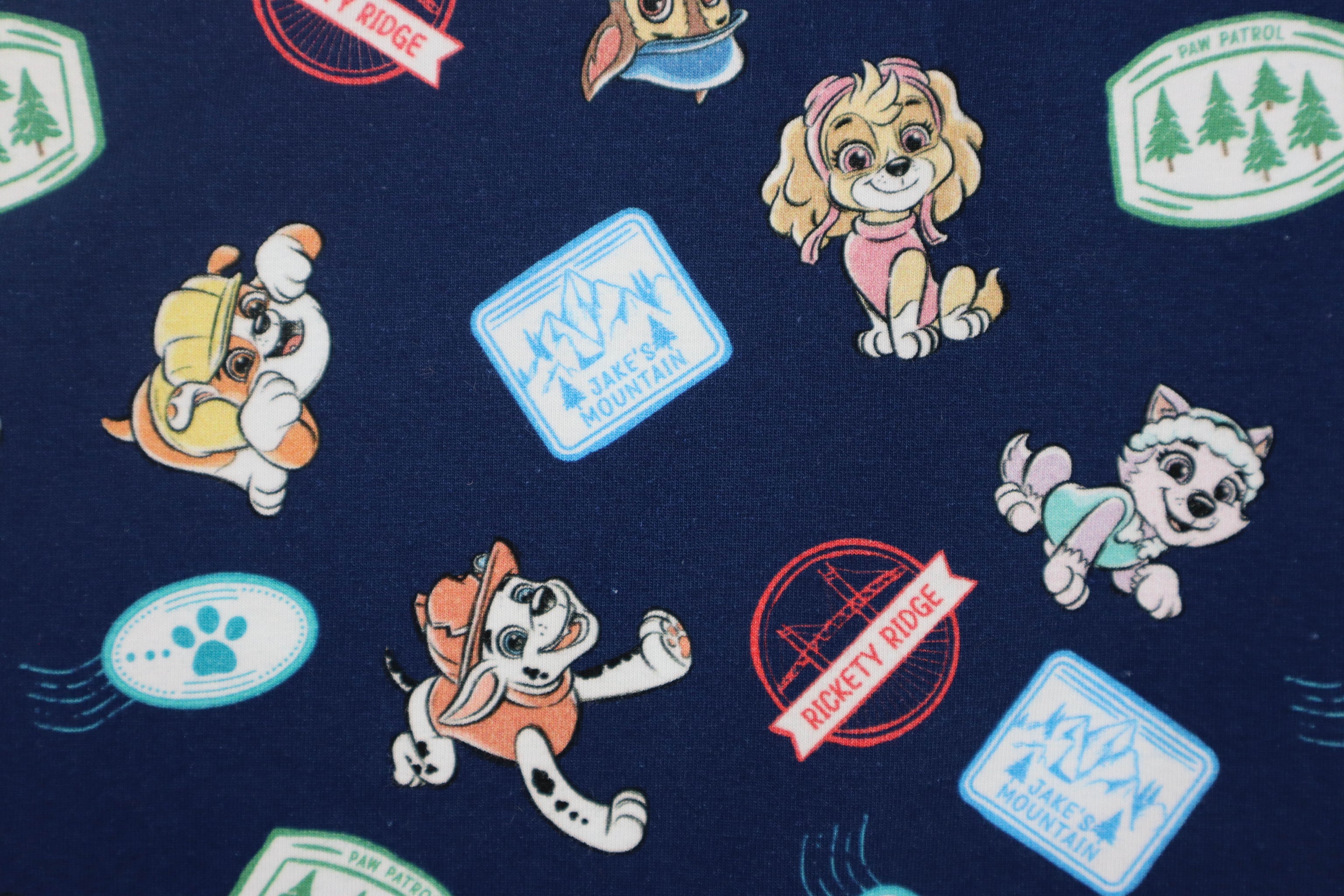 Baumwolljersey Paw Patrol - Sticker Print in dunkelblau bei Der Buntspecht